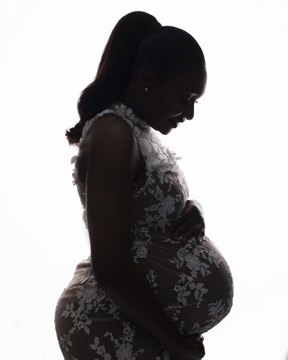 Side-profile maternity photoshoot in Surulere